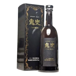 Bottle of dark liquor with a tall black box adorned with gold filigree and Chinese characters, labeled 'Excellent Quality'