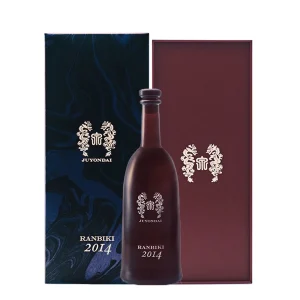 Glass bottle of dark red liquor with ornate crest, labeled 'RANBIKI 2014', set against matching decorative box packaging.