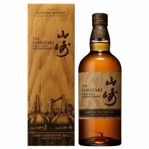 Bottle of The Yamazaki Limited Edition 2022 single malt Japanese whisky beside its wooden presentation box.