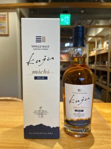 Box and bottle of Kujudistillery single malt Japanese whisky RD26 on a wooden table