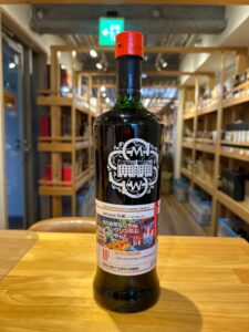 1 お酒買取専門店LIQUORJOYリカージョイ Bottle of single malt Scotch whisky on a wooden counter inside a shop red pour spout cap and ornate label visible