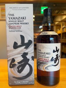 Box and bottle of The Yamazaki Single Malt Japanese Whisky Peated Malt Spanish Oak with bold kanji on the label and calligraphy on the box